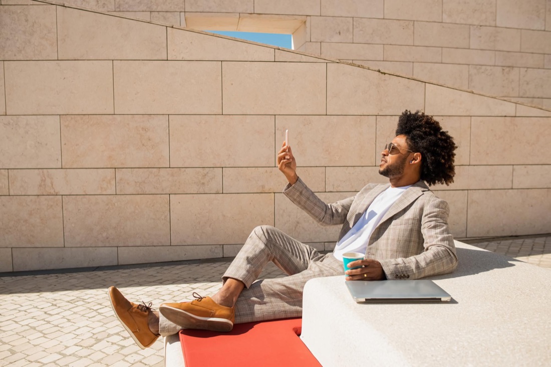 An investor checking his portfolio on his phone